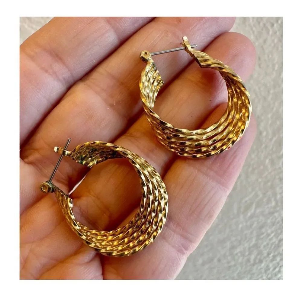 Gold tone asymmetrical hoop earrings